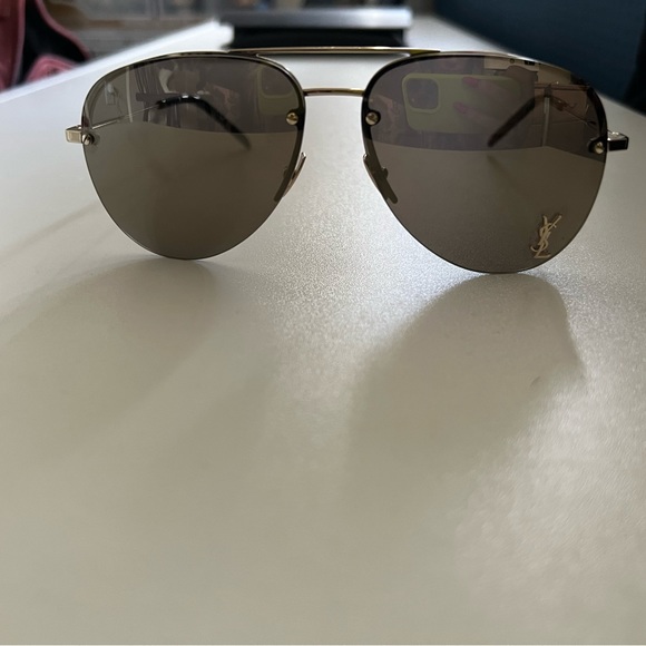 Yves Saint Laurent sunglasses gold case and cloth included